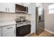 Modern kitchen with stainless steel appliances, white cabinetry, and sleek countertops at 8516 Paw Valley Ln, Charlotte, NC 28214