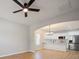 Open concept living space with a modern kitchen, stainless steel appliances, and wood plank flooring at 8516 Paw Valley Ln, Charlotte, NC 28214