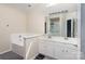 Large bathroom featuring double sinks, and a tub at 9410 Culcairn Rd, Huntersville, NC 28078