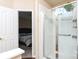 Elegant bathroom featuring shower with glass door and an open view into the bedroom at 9410 Culcairn Rd, Huntersville, NC 28078