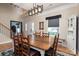 The dining room includes a large table with seating for six and an attractive light fixture at 9410 Culcairn Rd, Huntersville, NC 28078