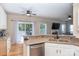 A modern kitchen with stainless steel appliances, granite countertops, and wood floors at 9410 Culcairn Rd, Huntersville, NC 28078