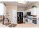 Charming kitchen featuring modern black appliances, countertops and white cabinetry at 9410 Culcairn Rd, Huntersville, NC 28078