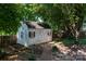 Well-maintained shed with double doors and charming window boxes in the backyard at 9410 Culcairn Rd, Huntersville, NC 28078