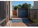 Backyard storage shed next to wooden fence and brick patio at 9410 Culcairn Rd, Huntersville, NC 28078