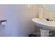 Small bathroom featuring a modern sink and toilet paper holder at 9530 Drains Bay Ct, Charlotte, NC 28214