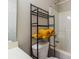 Bathroom features a black storage rack and yellow towels at 9530 Drains Bay Ct, Charlotte, NC 28214