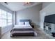 Bright bedroom featuring neutral tones and a vaulted ceiling at 9530 Drains Bay Ct, Charlotte, NC 28214
