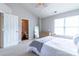 Relaxing bedroom featuring a cozy bed, dresser, and view into an ensuite bathroom at 9530 Drains Bay Ct, Charlotte, NC 28214