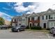 Well-maintained townhome exterior featuring classic architecture and convenient parking at 9530 Drains Bay Ct, Charlotte, NC 28214