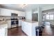 Modern kitchen with stainless steel appliances, white cabinets, and granite countertops at 9530 Drains Bay Ct, Charlotte, NC 28214