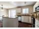 Well-equipped kitchen with a center island, stainless steel appliances, and ample counter space at 9530 Drains Bay Ct, Charlotte, NC 28214