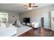 Bright living room with wood floors, plush seating, and a modern glass coffee table at 9530 Drains Bay Ct, Charlotte, NC 28214