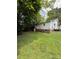 Spacious backyard featuring a well-maintained lawn and mature trees for ample shade at 1008 Packard Ave, Kannapolis, NC 28083