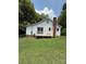 Spacious backyard featuring a patio and a well-maintained lawn at 1008 Packard Ave, Kannapolis, NC 28083