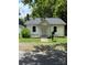 Charming single-story home with a cozy front porch and well-kept lawn and mature landscaping at 1008 Packard Ave, Kannapolis, NC 28083