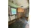 Kitchen featuring paneled walls and upper cabinets at 1008 Packard Ave, Kannapolis, NC 28083