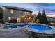Backyard features a pool, hot tub, patio and outdoor kitchen with a grill and bar at 1026 Arges River Dr, Fort Mill, SC 29715