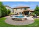 Lush backyard showcasing a pool, outdoor dining area, pergola, and well-maintained lawn at 1026 Arges River Dr, Fort Mill, SC 29715