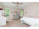 Bright bedroom with a large mirror dresser, a bed and lots of natural light at 1026 Arges River Dr, Fort Mill, SC 29715
