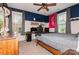 Comfortable bedroom with a wooden bed, windows with white blinds and a ceiling fan at 1026 Arges River Dr, Fort Mill, SC 29715
