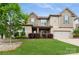 Charming two-story home with a lush lawn, shrubbery, and attached two car garage at 1026 Arges River Dr, Fort Mill, SC 29715