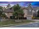 Beautiful two-story home with manicured lawn and stone accents, with an attached garage at 1026 Arges River Dr, Fort Mill, SC 29715