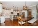 Open kitchen and dining space featuring an island with barstool seating and modern pendant lighting at 1026 Arges River Dr, Fort Mill, SC 29715