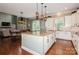 Bright kitchen with white cabinets, granite countertops, stainless steel appliances, and an open layout at 1026 Arges River Dr, Fort Mill, SC 29715