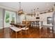 Open concept kitchen and dining area with white cabinets, granite countertops, and stainless steel appliances at 1026 Arges River Dr, Fort Mill, SC 29715