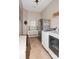 Functional laundry room with modern washer, dryer, stainless steel fridge, and plenty of storage at 1026 Arges River Dr, Fort Mill, SC 29715