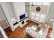 Bright living room with hardwood floors, a stone fireplace, and a comfortable sectional sofa at 1026 Arges River Dr, Fort Mill, SC 29715