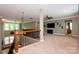 Spacious living room with a ceiling fan and lots of natural light from the windows at 1026 Arges River Dr, Fort Mill, SC 29715