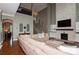 Spacious living room with hardwood floors, a stone fireplace, and a comfortable sectional sofa at 1026 Arges River Dr, Fort Mill, SC 29715