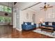 Spacious living room with hardwood floors, a blue sofa set and lots of natural light at 1026 Arges River Dr, Fort Mill, SC 29715