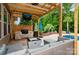 Outdoor living space features a bar, outdoor kitchen, grill, tv and patio furniture at 1026 Arges River Dr, Fort Mill, SC 29715