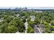 Scenic aerial view featuring property and verdant surroundings with the city skyline in the distance at 106 N Laurel Ave # 118, Charlotte, NC 28207
