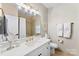 Contemporary bathroom featuring a glass shower, vanity with sink and gold hardware, with neutral finishes at 106 N Laurel Ave # 118, Charlotte, NC 28207