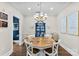 Elegant dining room with a round table and chandelier, perfect for gatherings at 106 N Laurel Ave # 118, Charlotte, NC 28207