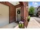 Charming front door with a wreath and flower pots create a welcoming entrance at 106 N Laurel Ave # 118, Charlotte, NC 28207