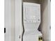 Efficient laundry closet featuring a stacked washer and dryer at 106 N Laurel Ave # 118, Charlotte, NC 28207