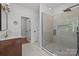 Modern bathroom featuring a glass shower with decorative tile and fixtures at 108 Woodwinds St, Locust, NC 28097