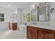 Elegant bathroom featuring double vanities, soaking tub, and a scenic window at 108 Woodwinds St, Locust, NC 28097