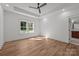 Well-lit bedroom with ceiling fan, recessed lights and scenic window, providing a peaceful sanctuary at 108 Woodwinds St, Locust, NC 28097