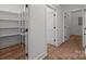 Spacious walk-in closet with built-in shelving for optimal organization and storage at 108 Woodwinds St, Locust, NC 28097