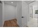 Walk-in closet with hardwood flooring and a door leading to the bathroom at 108 Woodwinds St, Locust, NC 28097
