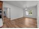 The dining room features wood flooring and lots of natural light at 108 Woodwinds St, Locust, NC 28097