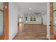 Inviting foyer leading into a bright, open-concept living space with wood flooring at 108 Woodwinds St, Locust, NC 28097