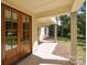 Detailed close up of double door front entrance showing craftsman style elements and covered entrance at 108 Woodwinds St, Locust, NC 28097
