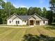 Charming single-story home featuring a landscaped yard, craftsman style architecture, and inviting front entrance at 108 Woodwinds St, Locust, NC 28097
